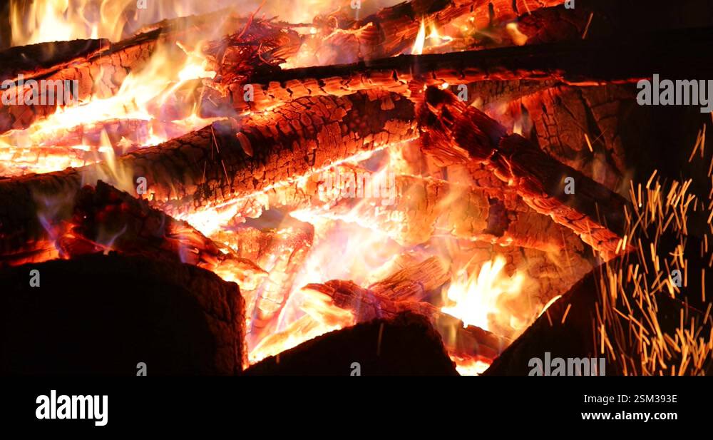 Burning log of wood and sparks close-up, slow motion Stock Video ...