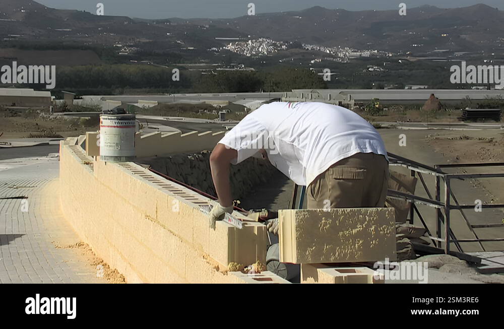 Bricklayer putting brick making an exterior industrial wall Stock Video ...