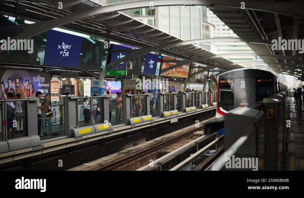 BTS Sky Train In Bangkok Thailand. Passenger POV Waiting On Platform ...