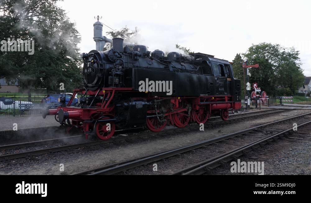 Steam locomotive driving backwards on railroad track Stock Video ...