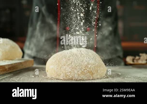 Super Slow Motion of Chef Throwing Flour on Yeast Dough. Filmed on High ...