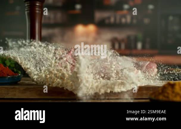 Super Slow Motion of Chef Throwing Raw Chicken Legs into Flour. Filmed ...