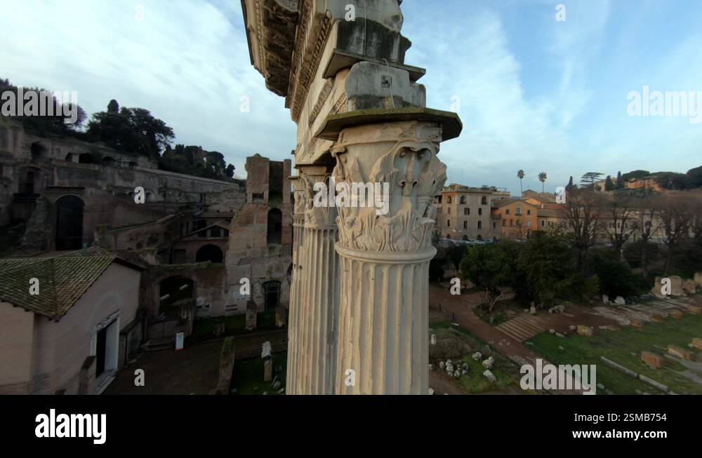 Columns among the remains of Ancient Rome at the Roman Forum. Colosseum ...