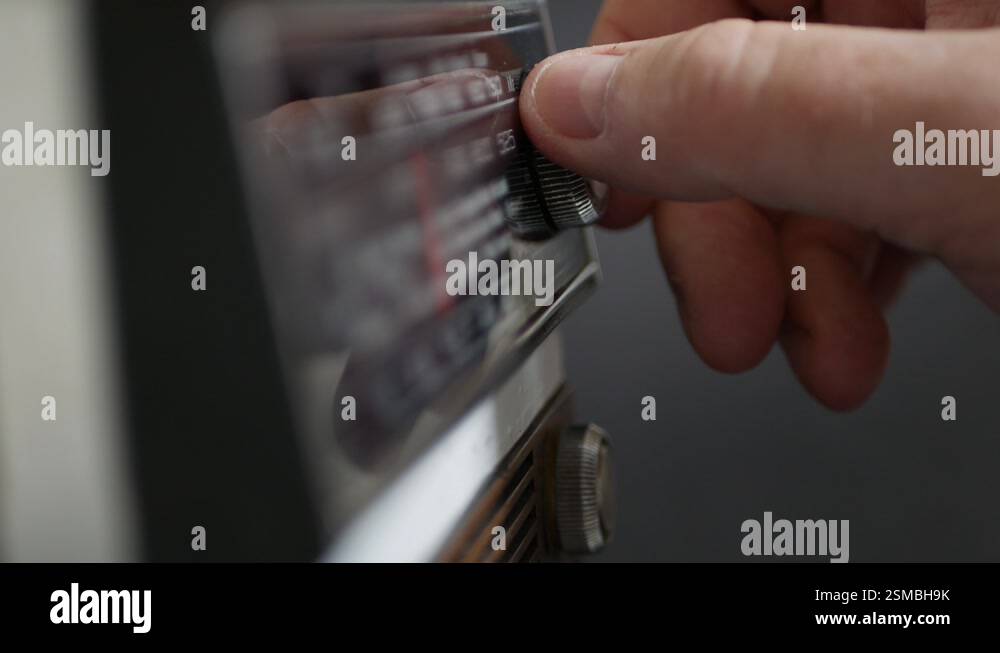 One Person Searching a Radio Station or a Music Radio Rotating ...