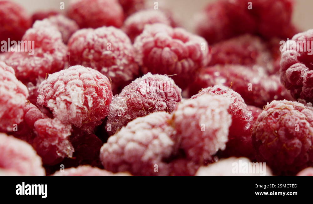 The sweetest frozen raspberries with beautiful ice and frost crystals ...
