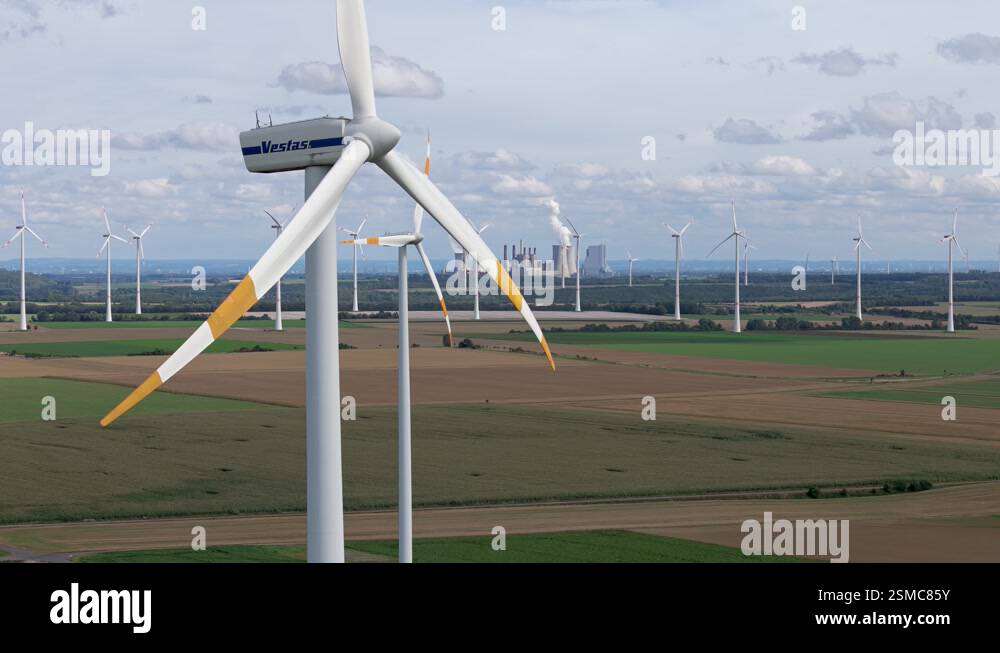 Wind farm with turbines and Lausward nuclear power plant in the ...