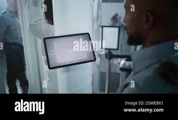 Advanced Security System in Airport: African American Security Officer ...