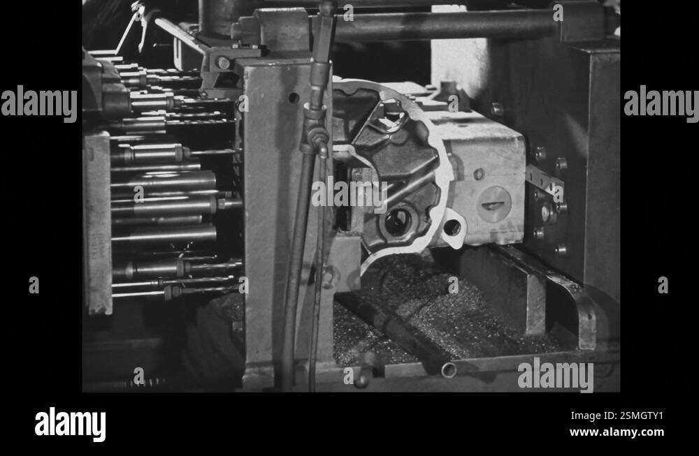 1940s: A close-up view of a metalworking machine in operation during ...