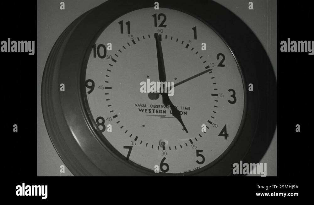1940s: A clock displaying Naval Observatory time is shown in the film ...