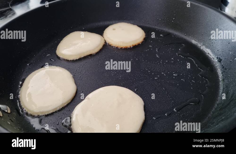 Image showcasing Homemade Pancakes Cooking in Non-Stick Pan for a Delicious Breakfast ...