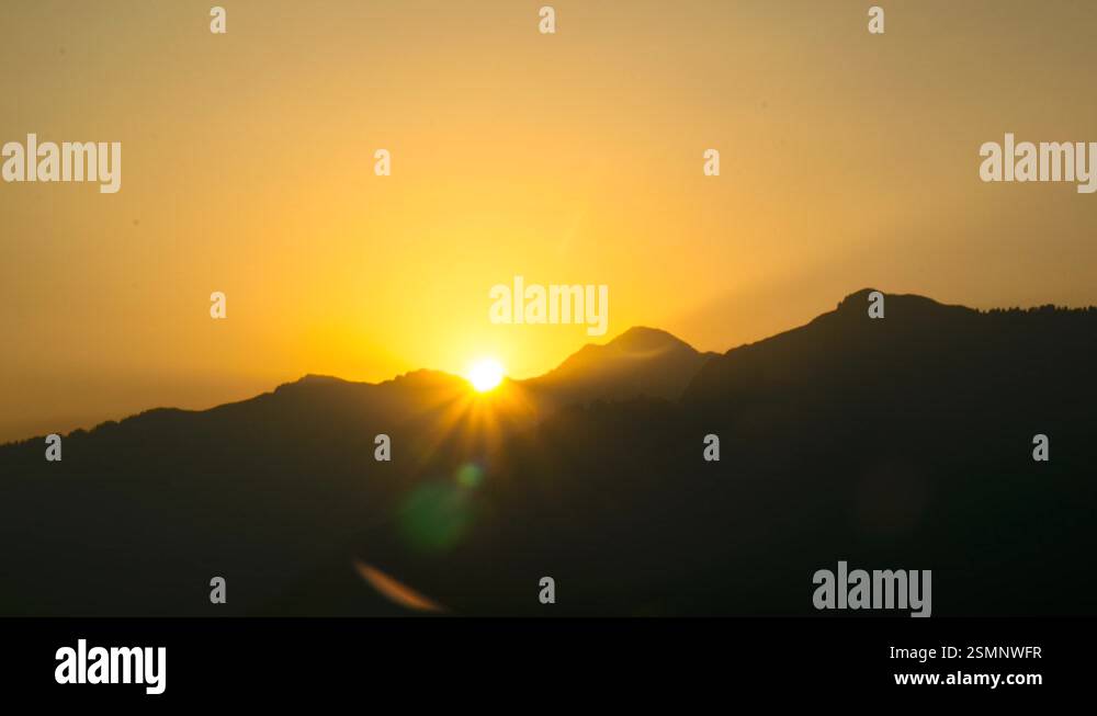 Sun rising behind mountains Stock Videos & Footage - HD and 4K Video ...