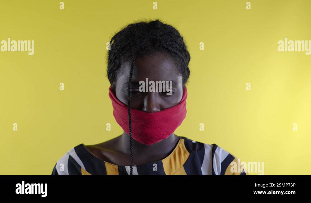 Defiant Black Woman Unveiling Mouth, Symbolizing Fight Against Female ...