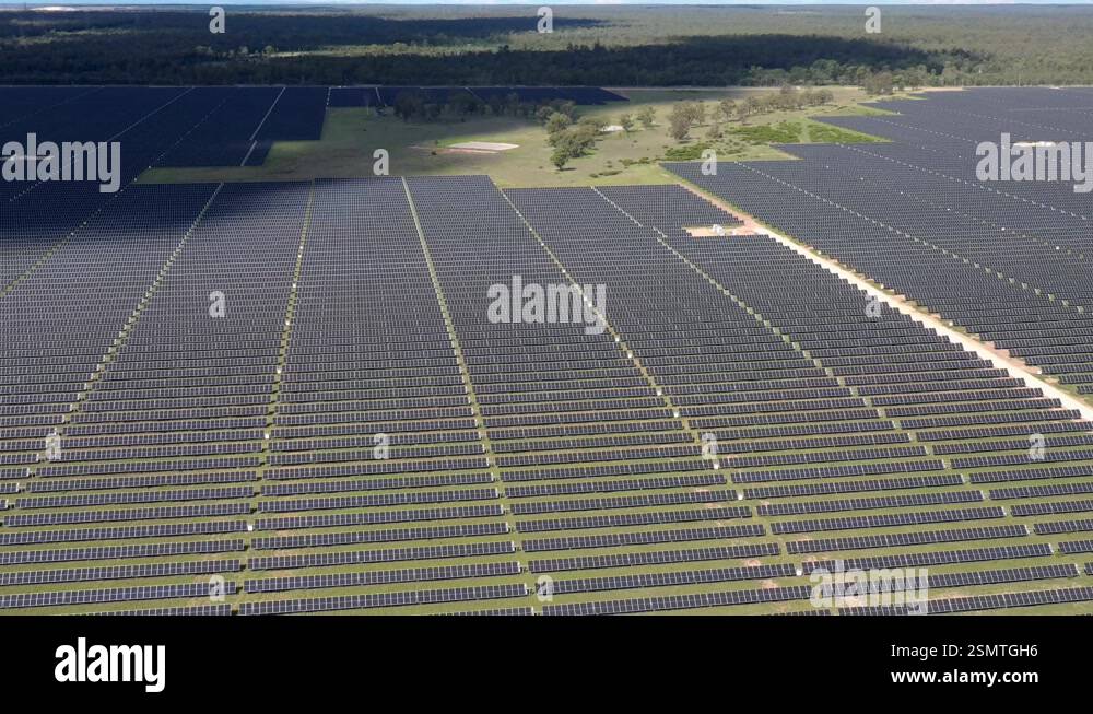 Aerial 4K view of a large-scale solar farm in Australia, highlighting ...