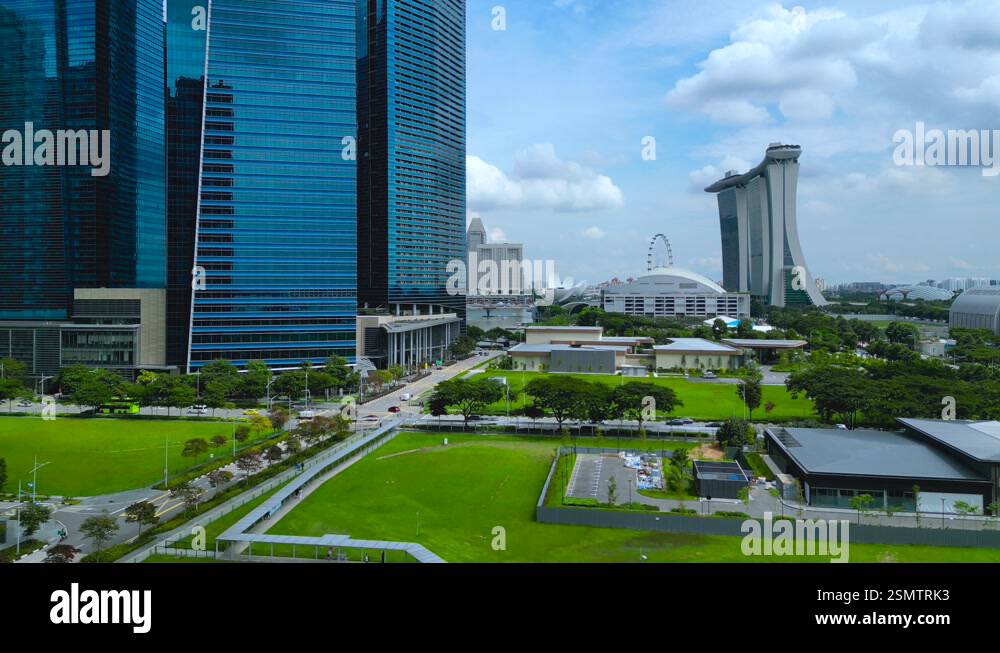 Straits View of Singapore during a sunny blue sky day and the iconic ...