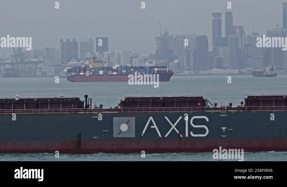 Singapore, Singapore - 09/04/2024: A large container ship sails in ...