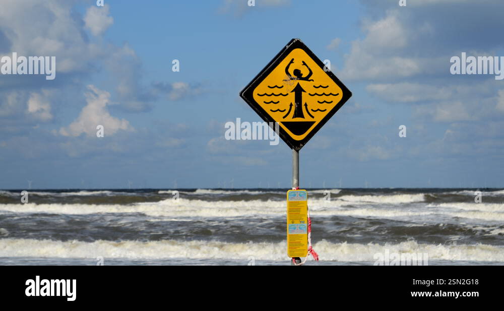 Rip Current Warning Sign with Windmills Stock Video Footage - Alamy