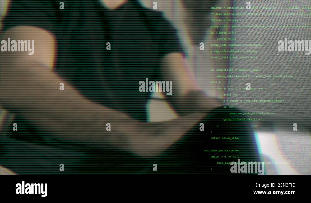 Close-up of man coding with green text overlay. Cybersecurity and data ...