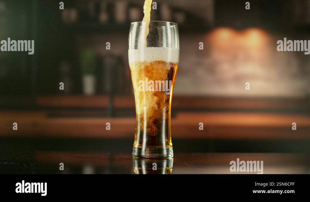 Super Slow Motion of Pouring Beer into Long Pint Stock Video Footage ...