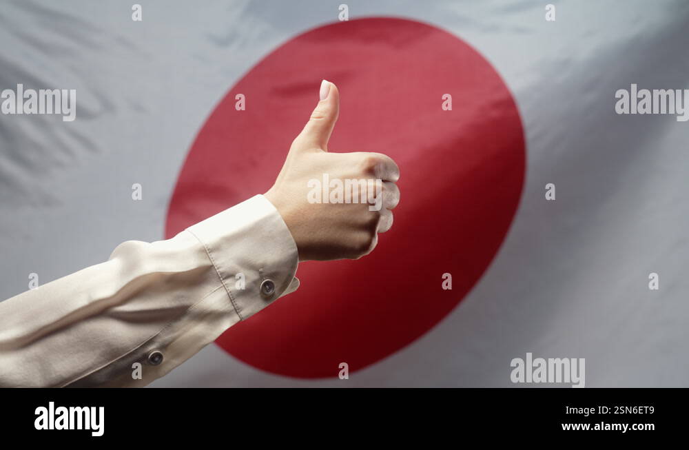 Woman Makes Hand Sign Like, Thumb Up Gesture on japanese flag ...