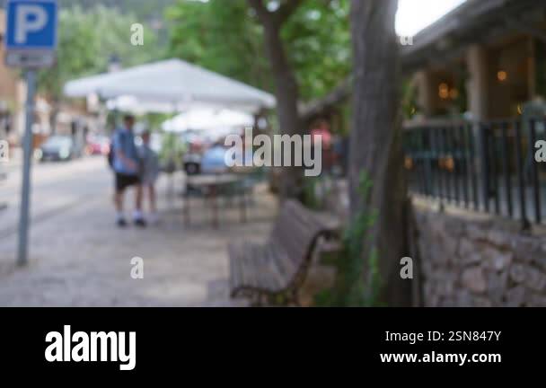 Defocused outdoor scene in mallorca with blurred people sitting at a ...