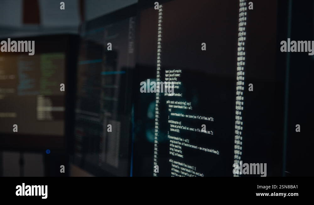 Lines of Computer Code Running on Black Screen in Dark Control Room ...