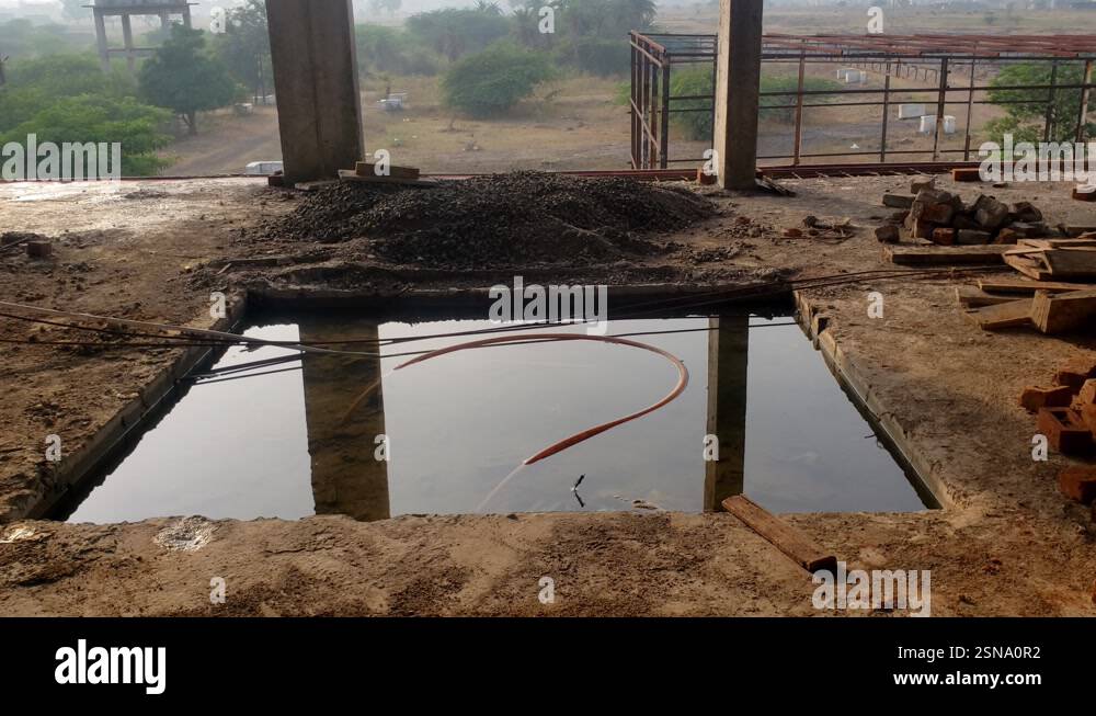 structural columns and a partially constructed building, with a view of ...