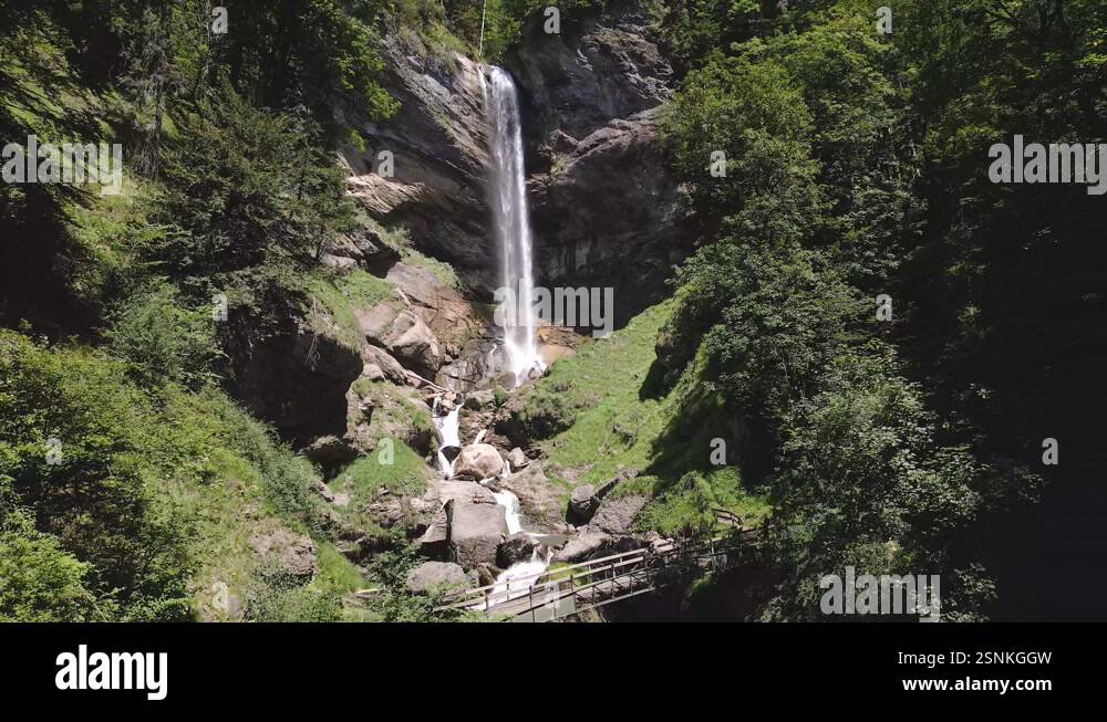 Berschnerfall waterfall cascading down rocky cliffs in swiss alps on ...