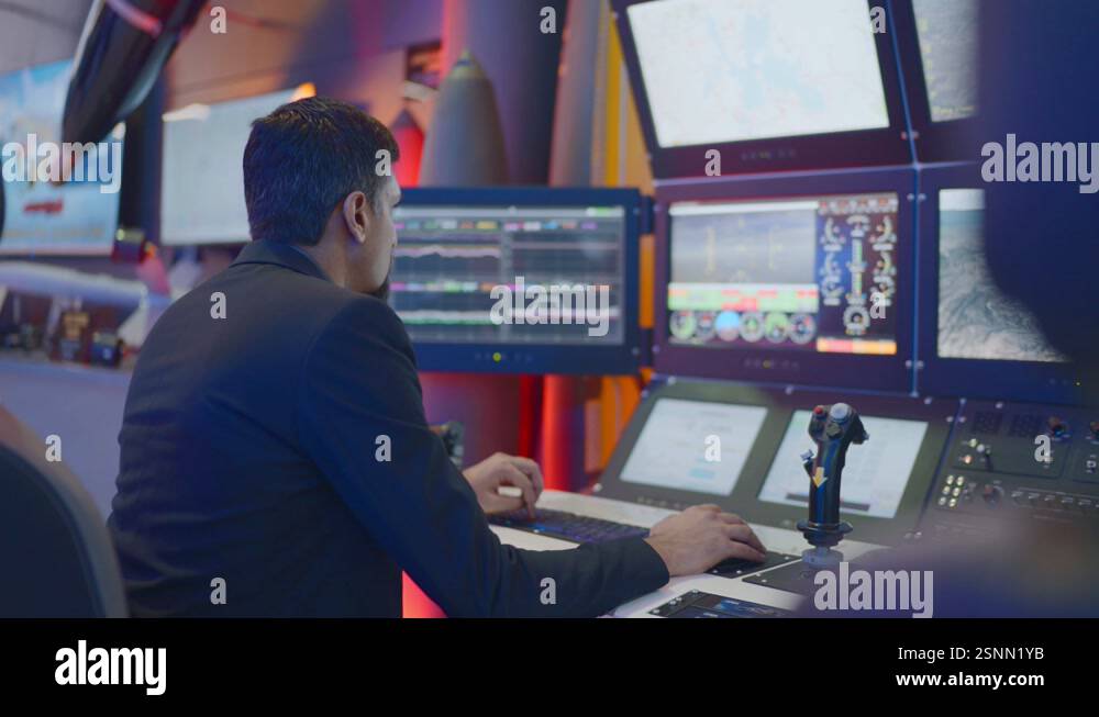 Pakistani man handling control panels of war jets in IDEAS Expo of ...