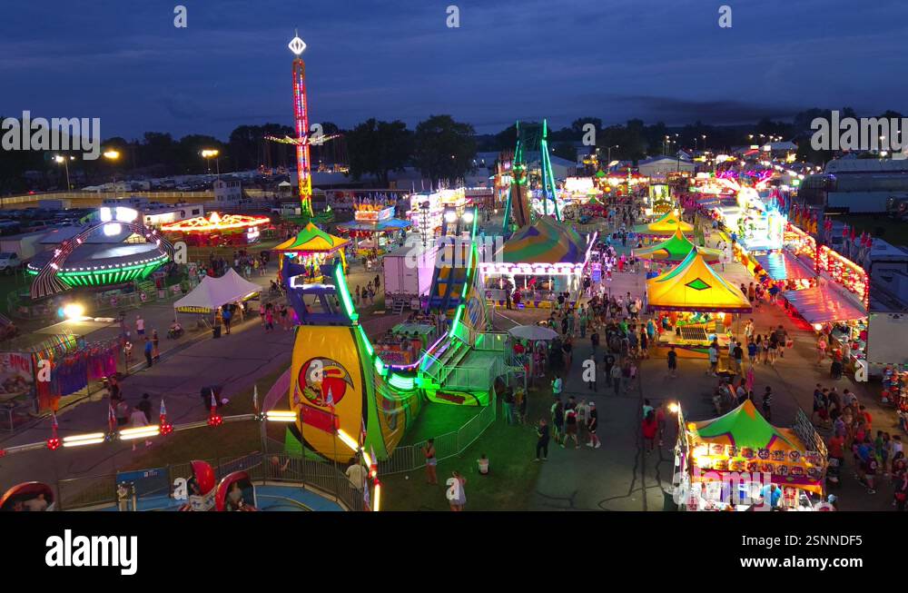 Monroe County Fair, vibrant carnival scene at night with colorful ...