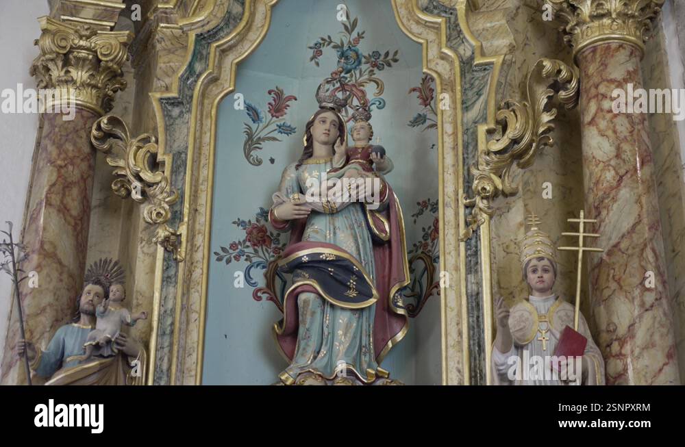 Ornate church altar with statues of the Virgin Mary and child ...