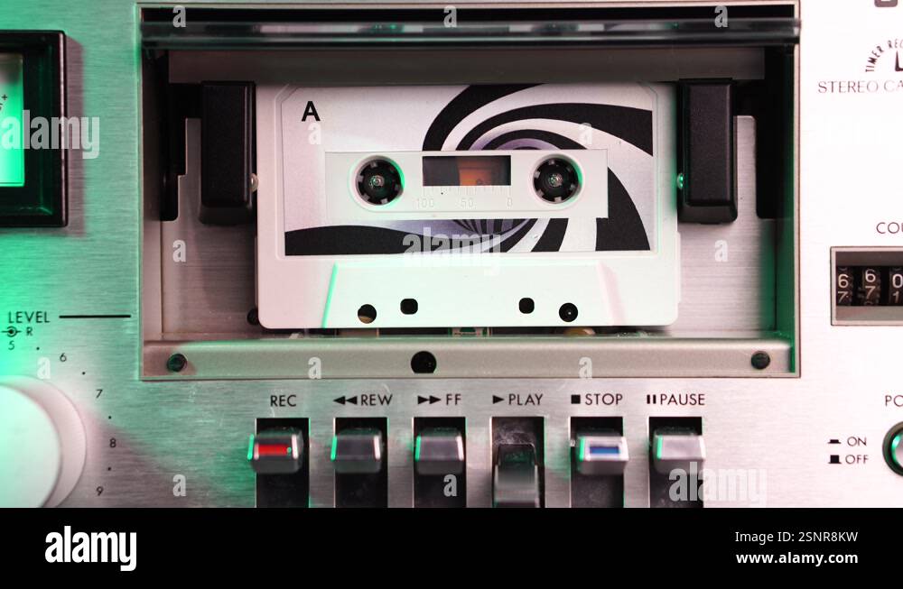 Audio Cassette Tape Playback in Vintage Deck Player From 1970's Stock ...