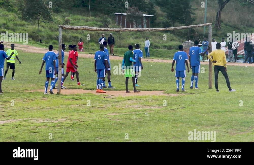 Africa men playing in the village football pitch. Games in rural parts ...