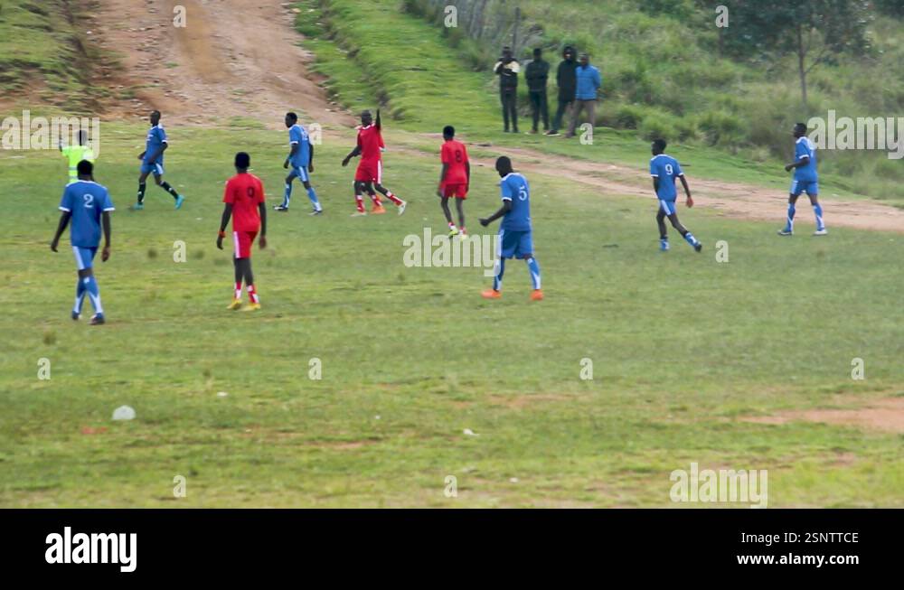 Africa men playing in the village football pitch. Games in rural parts ...