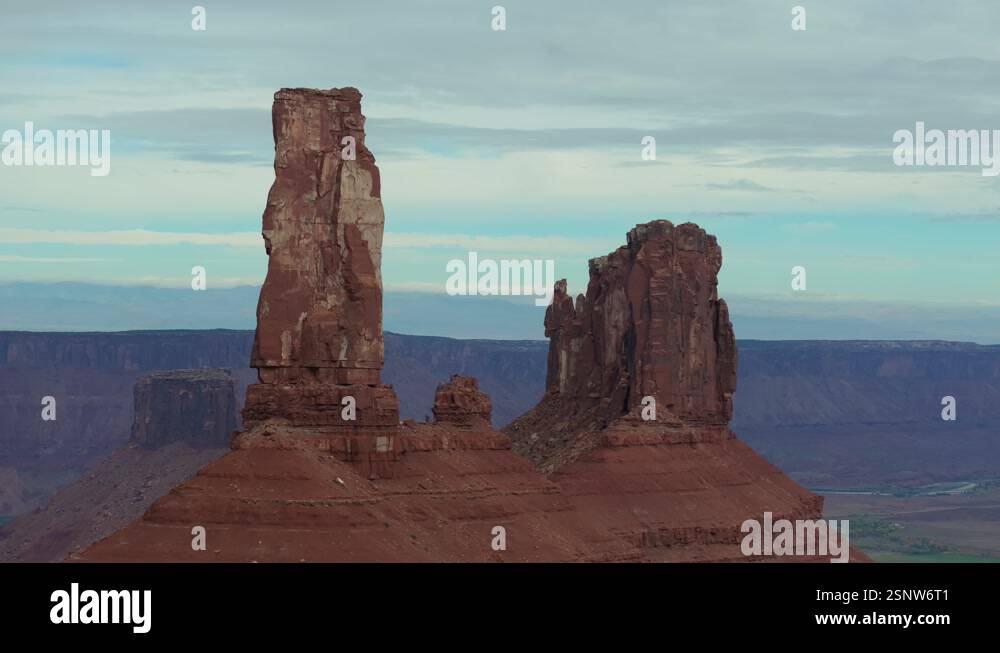 Towering Castleton Tower in Moab Utah’s vast desert landscape, an ...
