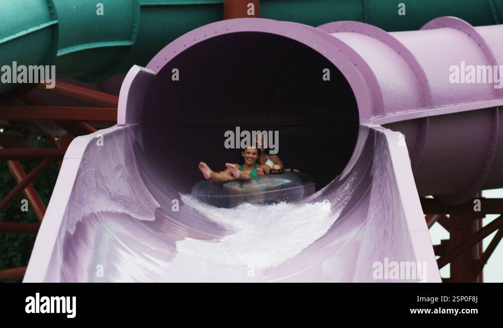 two girls on a waterslide Stock Video Footage - Alamy