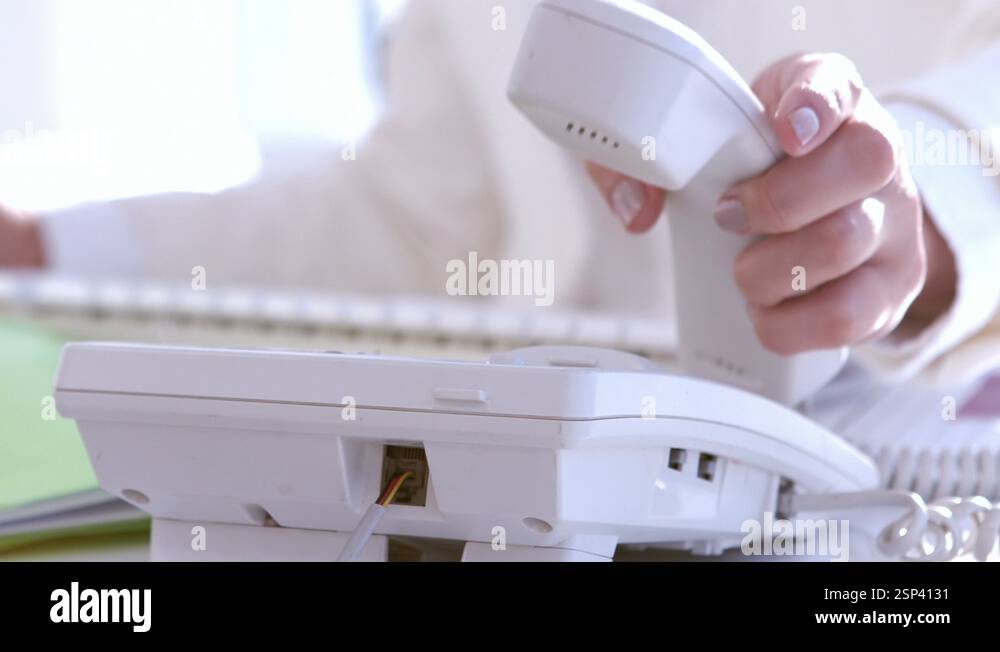 Businesswoman answering the phone Stock Video Footage - Alamy