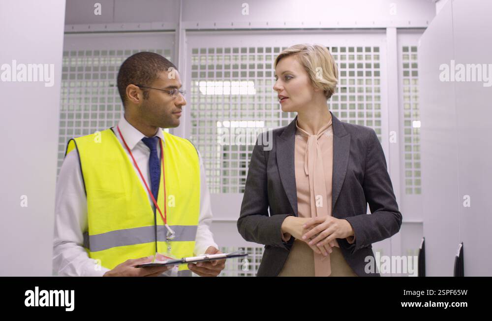 4K Group of computer technicians checking machines in a data center ...