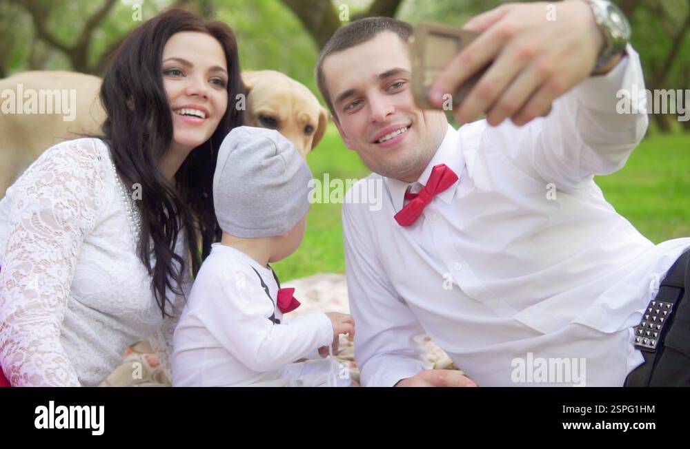 Dad Mom Kid and dog do the salfi in the park. Slow motion Stock Video ...