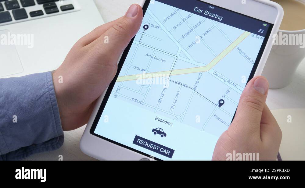 Man requests car using car sharing application on the digital tablet ...