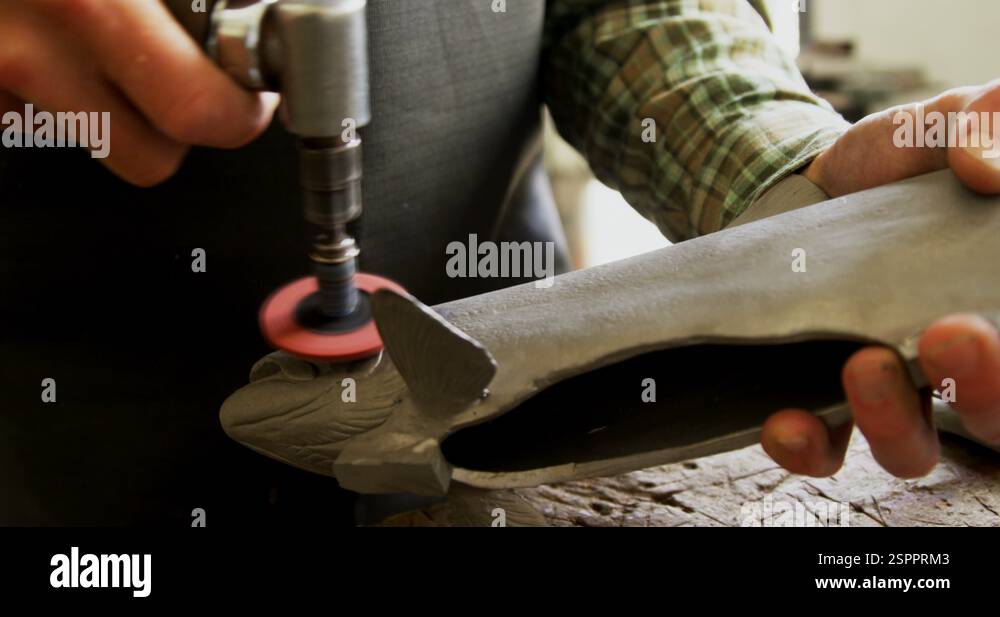 Craftsman polishing fish sculpture in workshop 4k Stock Video Footage ...