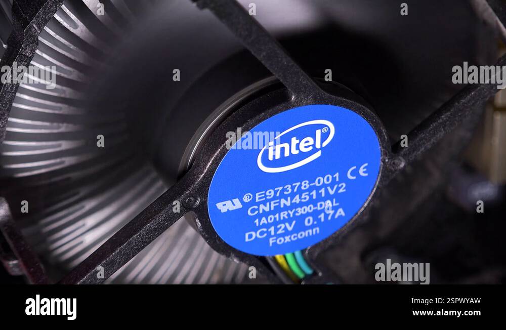 A spinning fan with an Intel logo inside a computer case - closeup ...