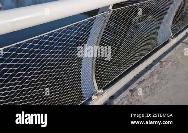 stainless steel mesh stretched on bridge railing.lower steel rope ...
