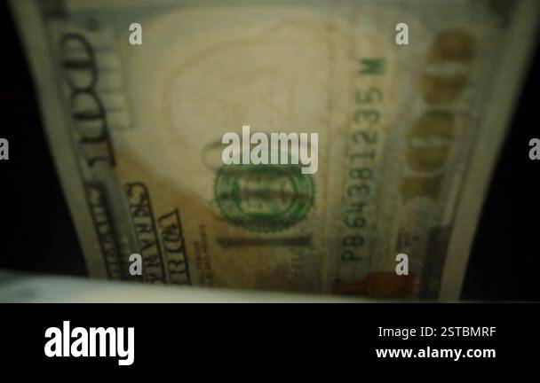 Close-Up View of a Hundred-Dollar Bill Highlighting Serial Numbers and ...