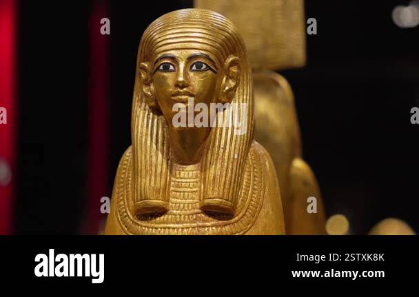 Majestic golden statue of Egyptian pharaoh stands proudly, ancient ...