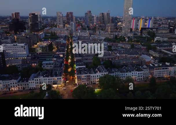 Twilight view of Rotterdam as the city lights up the skyline and ...
