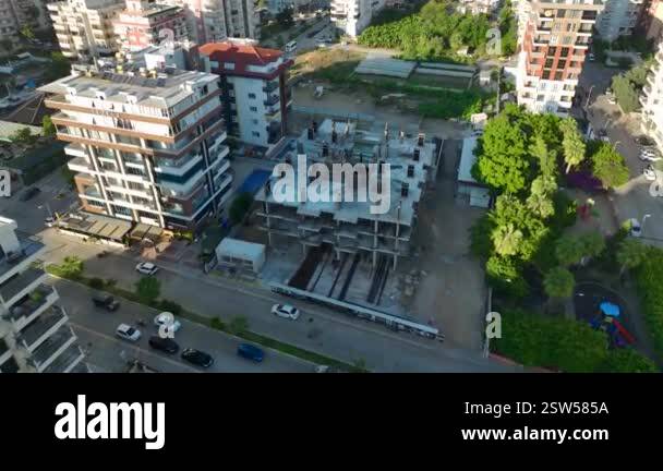 The construction of a luxury high-rise building is advancing as workers ... - Luxury High-Rise Building Construction