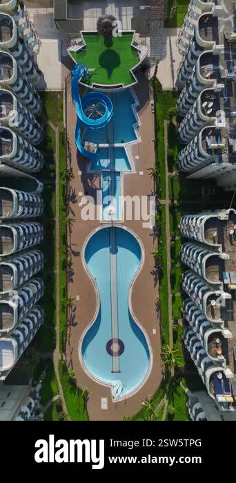 Aerial empty pool in a resort. Vertical footage of a quiet residential ...
