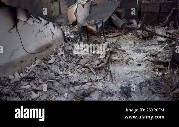 Fire Ravaged Charred The charred remnants left behind from a fireravaged space vividly ...