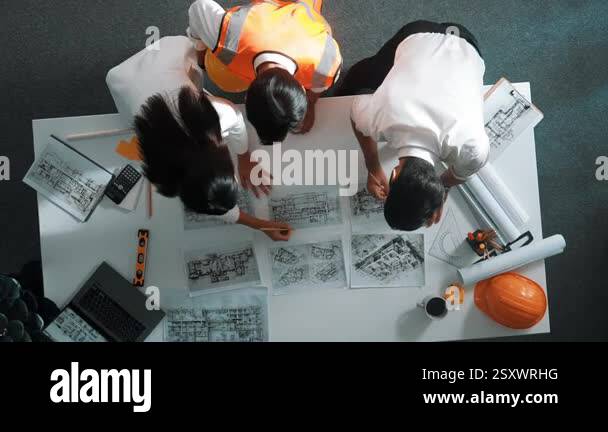 Engineering Place Top down view of smart architect engineer place document at meeting ...