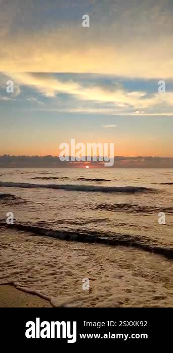 Beautiful sunrise on sea. Rising sun over sea. Sun shining from behind ...